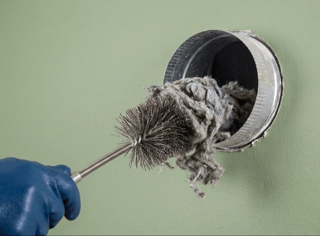Technician cleaning air ducts to improve indoor air quality